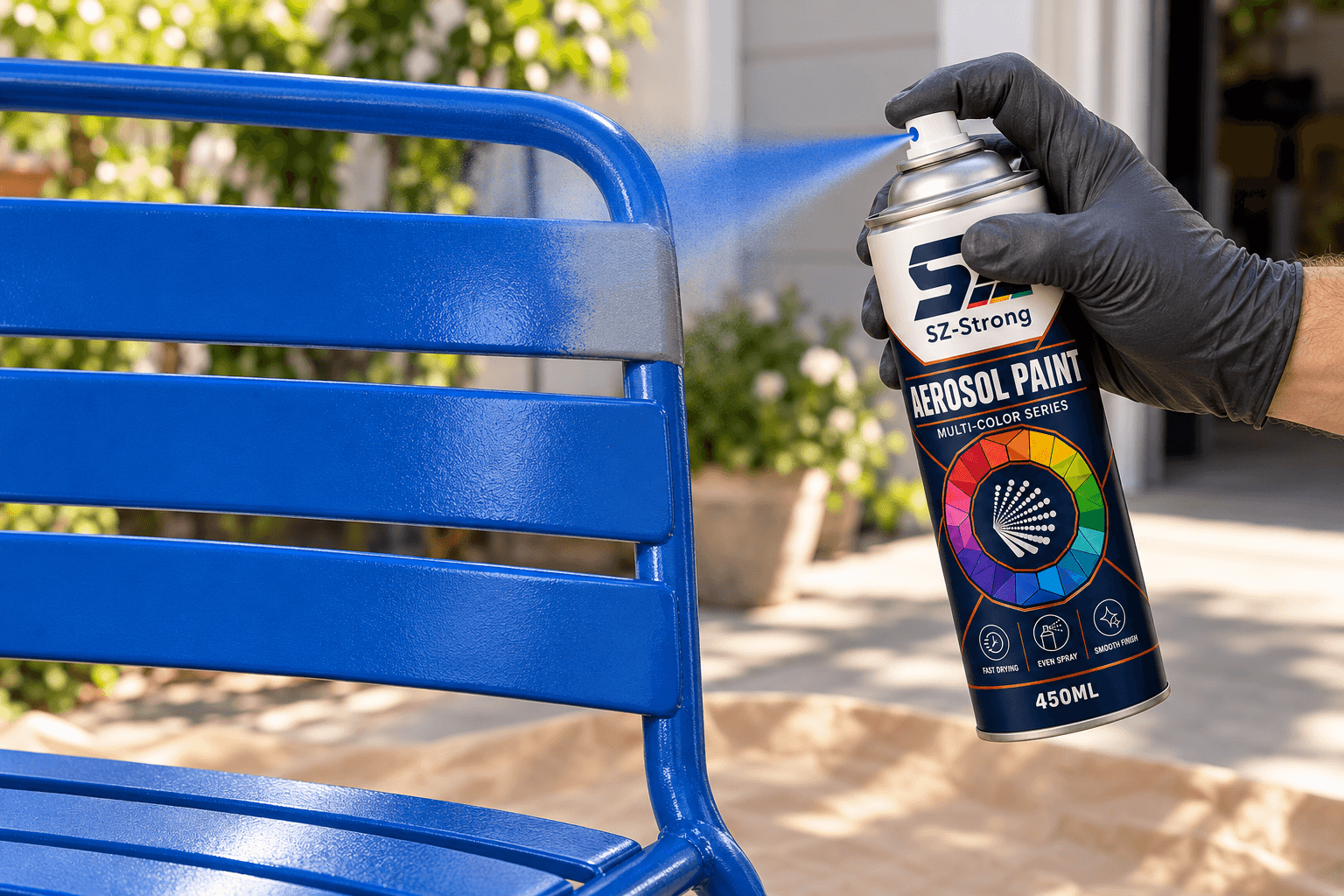 SZ-Strong Aerosol Paint 450 mL can spraying a blue metal chair frame